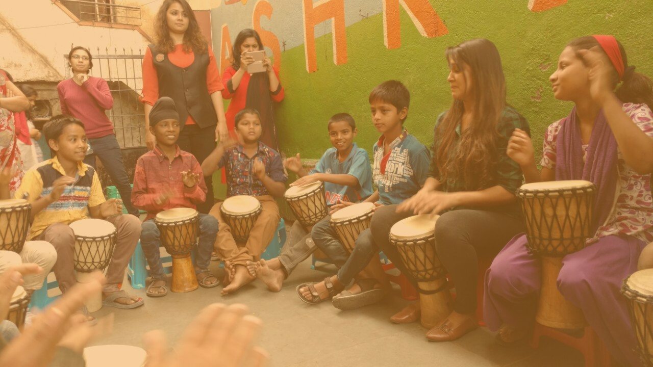 Neha Oswal and Anshu Kering leading a Taal Inc. School Drum Circle
