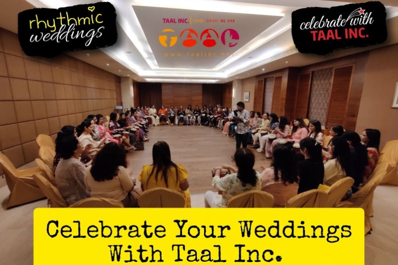 Group of people participating in a drumming activity